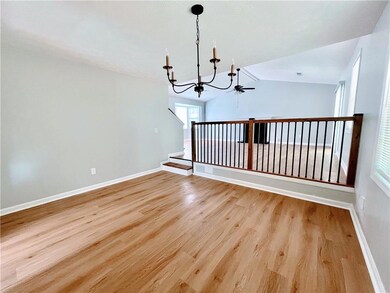 Unfurnished room with baseboards, light wood-type 
