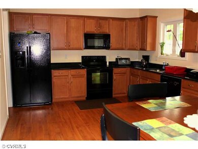 Kitchen - Granite counters, laminate floor, upgrad