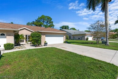 Ranch-style home featuring a garage, driveway, a f