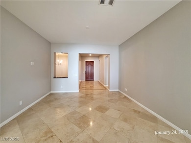 Spare room with baseboards and visible vents