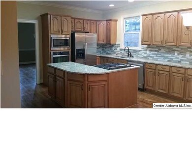 Large open kitchen with granite counter tops, marb