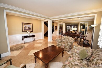 Formal living room and dining room with custom wai