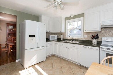 Immaculately kept, this kitchen has updated tile, back splash & paint.