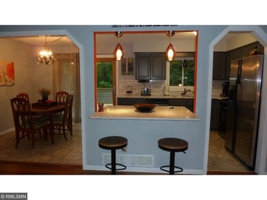 Open concept with quartz breakfast bar.