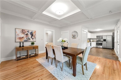 Dining area fits a large table plus additional cabinets or buffet furniture