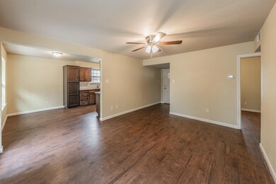 Family room overlooking breakfast nook, front entry and kitchen