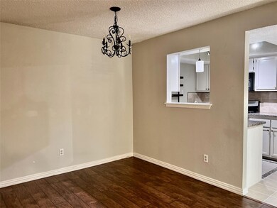 Unfurnished dining area featuring dark wood-type 