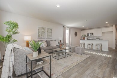 Living area featuring recessed lighting and light wood finished floors