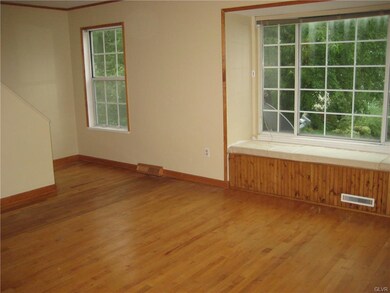 Hardwood floors highlight the large living room.