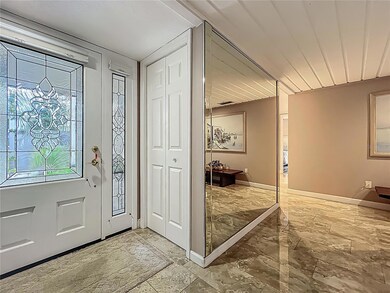 mirrored foyer with coat closet