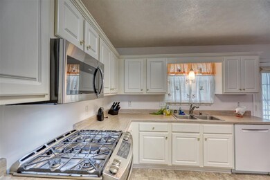 Stainless steel gas oven and microwave.