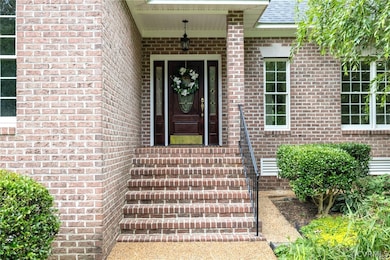 Covered entry.  3 sides of Brick