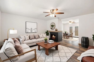 Living room featuring wood finished floors, a bri