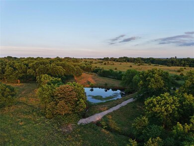 Aerial view of property's location featuring a large body of water