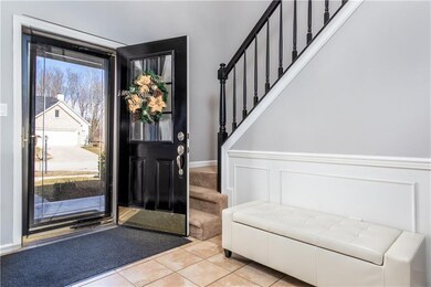 Entrance to home with 2 story entrance.  New chandelier at entry. 