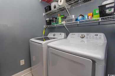 Washroom featuring independent washer and dryer