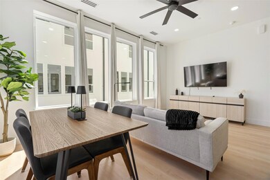 Living area with recessed lighting, visible vents,
