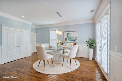 Dining shown with virtually staged round table. Ow