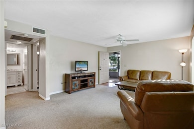  living room featuring ceiling fan