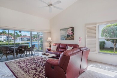 Living room with light hardwood / wood-style floor