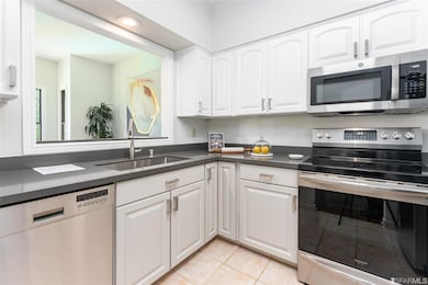 The kitchen is open to both the dining and living room areas