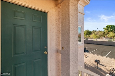 View of exterior entry featuring stucco siding
