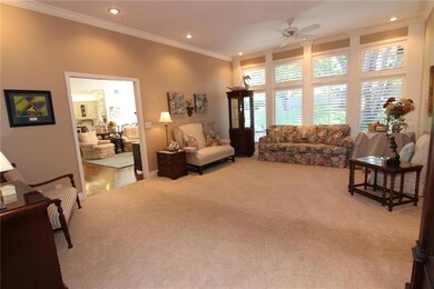LIVING ROOM WITH VIEWS INTO HEARTH ROOM/KITCHEN. M