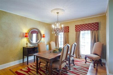 Dining room with inlaid hardwood flooring