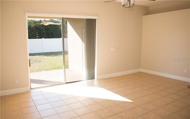 Large family room with tiled flooring, and access 
