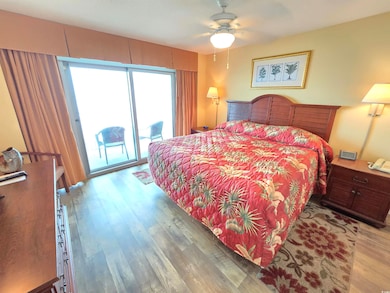 Bedroom with access to outside, ceiling fan, and l