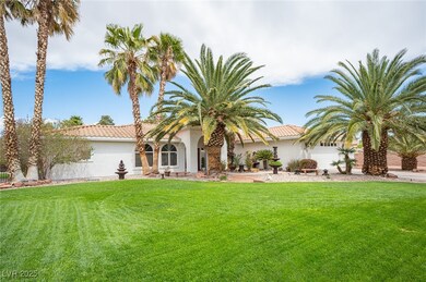 Rear view of house featuring a tile roof, stucco s