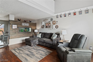 Living area featuring wood finished floors, wood w