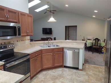 Kitchen featuring hanging light fixtures, backspla