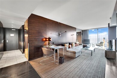 Living room featuring expansive windows and wood f