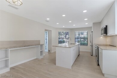 Kitchen with visible vents, a kitchen island with