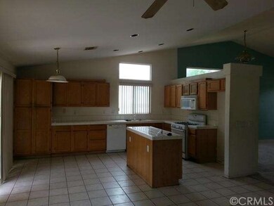 Open  kitchen with small island, recess lights