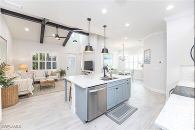 Kitchen featuring decorative light fixtures, dishw
