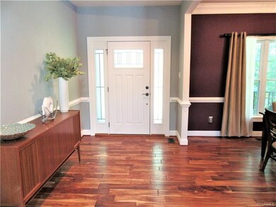 The Welcoming Foyer is accentuated with Teak Hardw