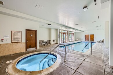 View of swimming pool with an indoor in ground hot