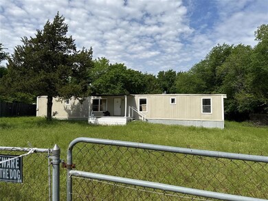 View of front of property featuring a porch and a front lawn