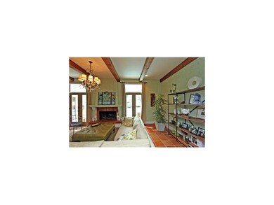 New French doors in the family room lead to pool.