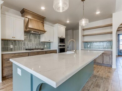 Kitchen with custom exhaust hood, stainless steel 
