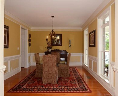 Large dining room with heavy molding.