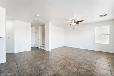 Empty room with tile patterned floors, visible ven