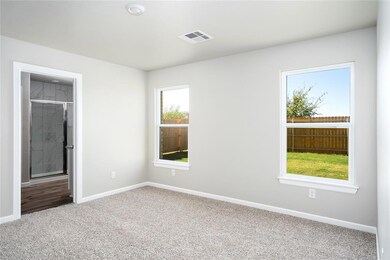 The master retreat features its own walk-in closet