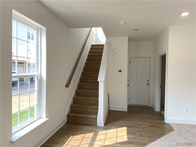Stairs featuring light carpet