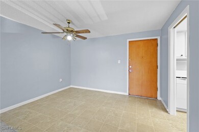 Empty room with ceiling fan and baseboards