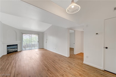 Unfurnished living room featuring visible vents, b