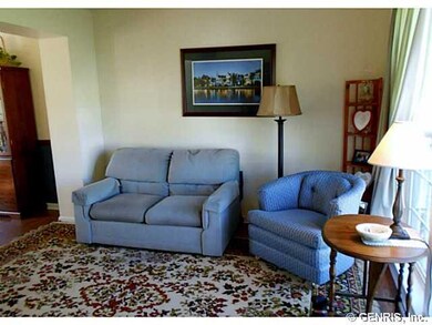 Living Room. The living room is a pale yellow, wit