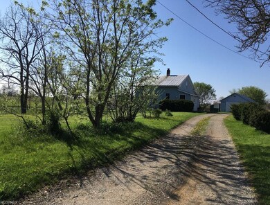 Back of the house and second driveway.